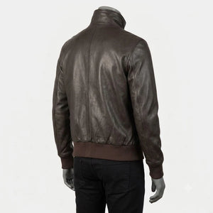 A dark brown leather jacket with a high collar and ribbed knit trim at the hem and cuffs, shown from the back on a mannequin wearing black pants against a light gray background.