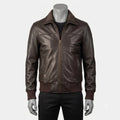 A dark brown leather jacket displayed on a gray mannequin torso, styled over a black shirt and black pants against a light gray background.