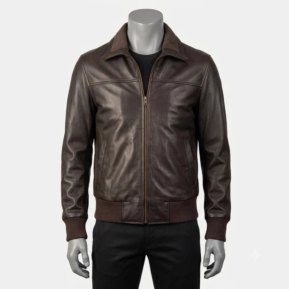 A dark brown leather jacket displayed on a gray mannequin torso, styled over a black shirt and black pants against a light gray background.